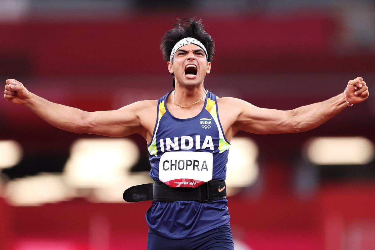 Javelin thrower Neeraj Chopra celebrating after winning India's first athletics gold at the Olympic Games at Olympic Stadium in Tokyo.