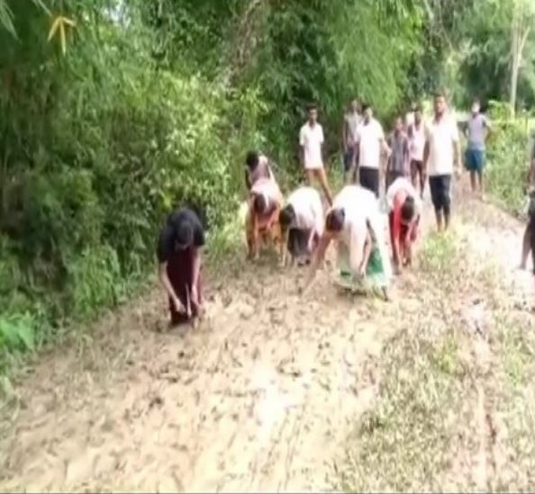 assam: locals protest poor condition of dibrugarh road, sow paddy on it