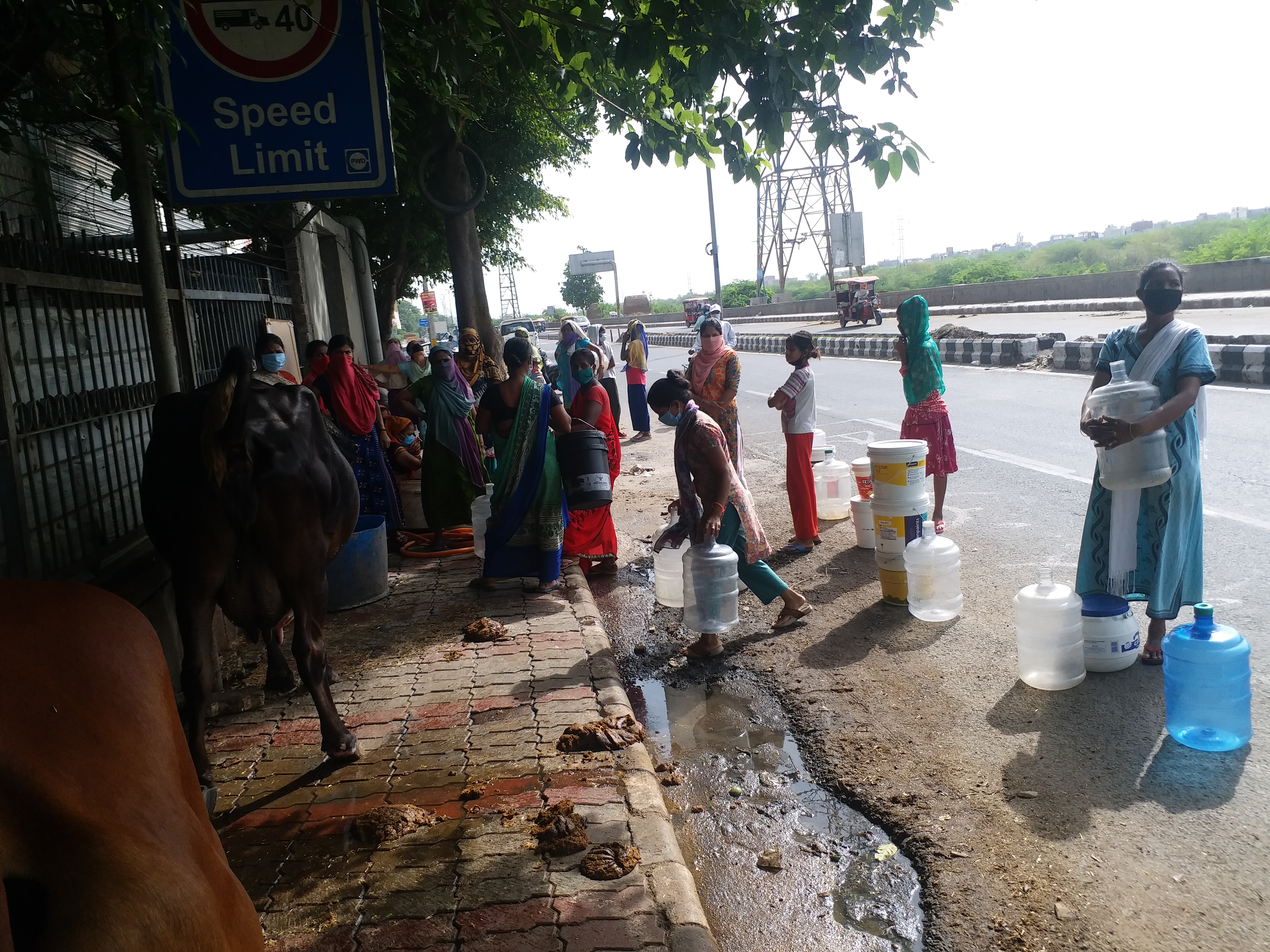 Residents of Chilla village of delhi are forced to stand in queues for hours waiting for water