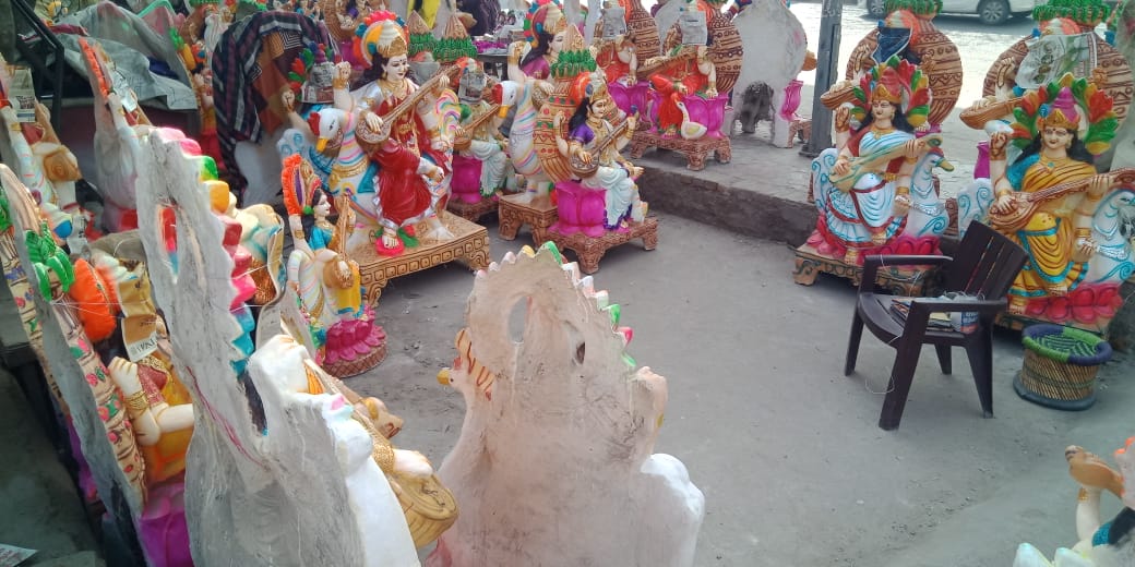 crowd in nangloi market market regarding saraswati puja