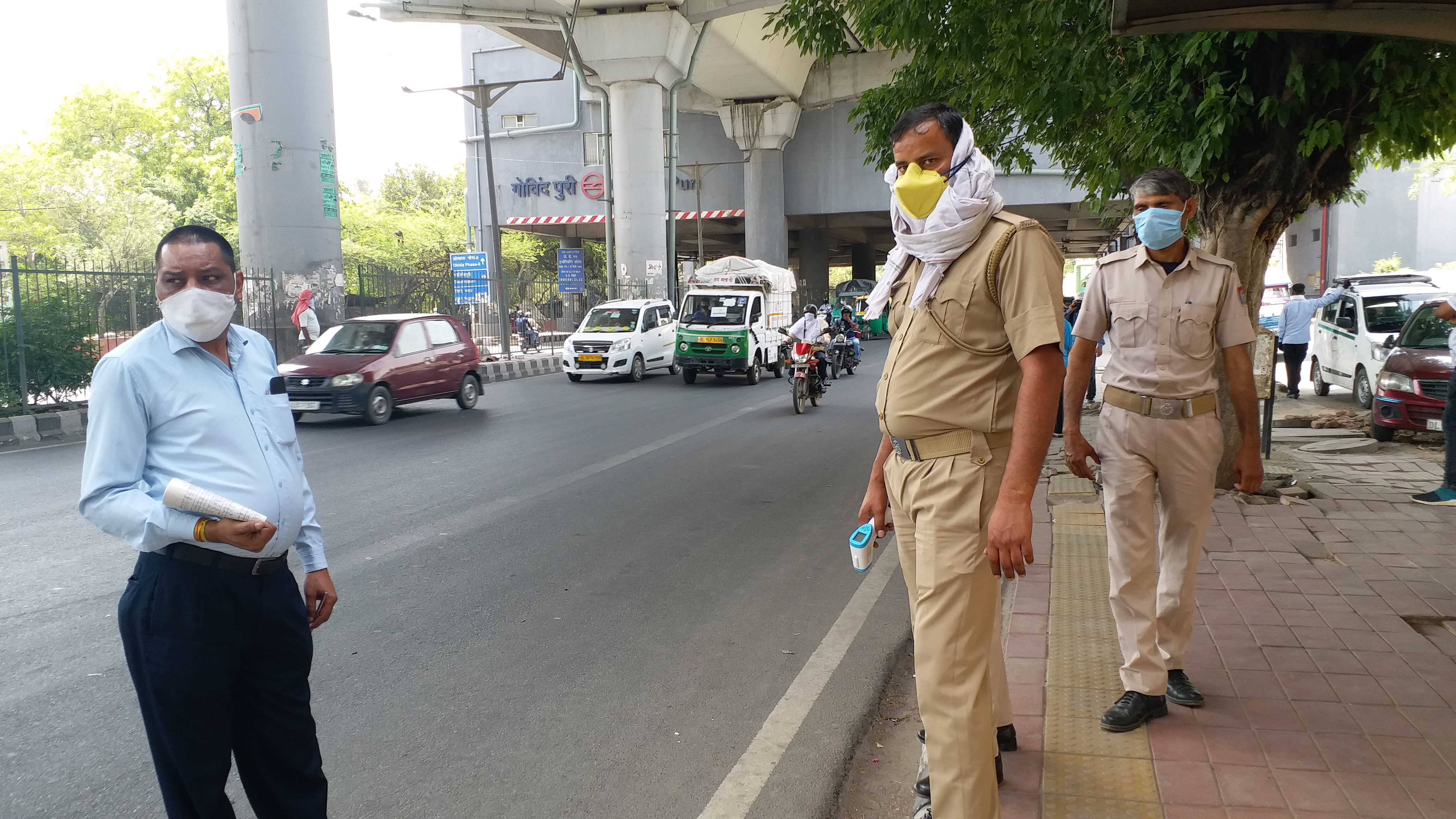 Thermal screening of people being done at bus stop due to corona