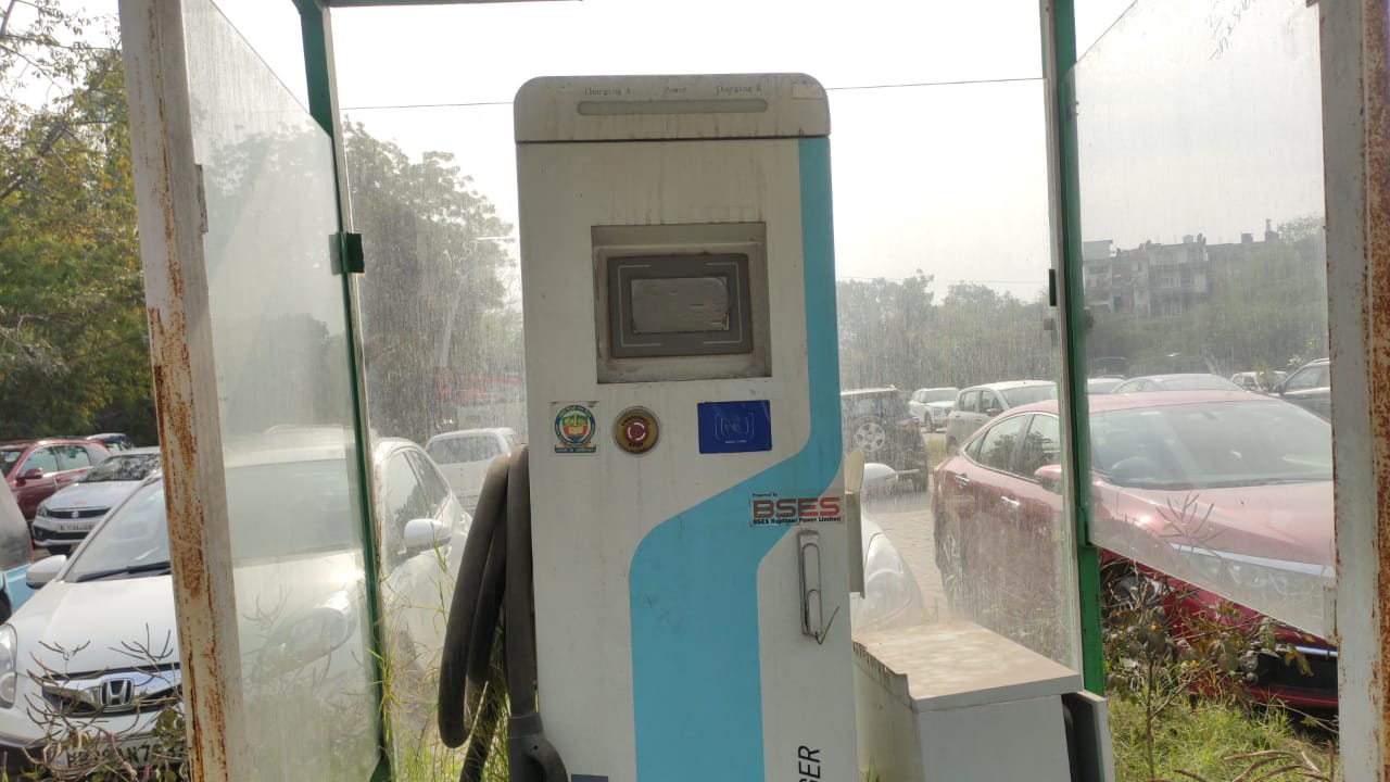 electric vehicle charging machines in Hauz Khas Village parking lot are abandoned