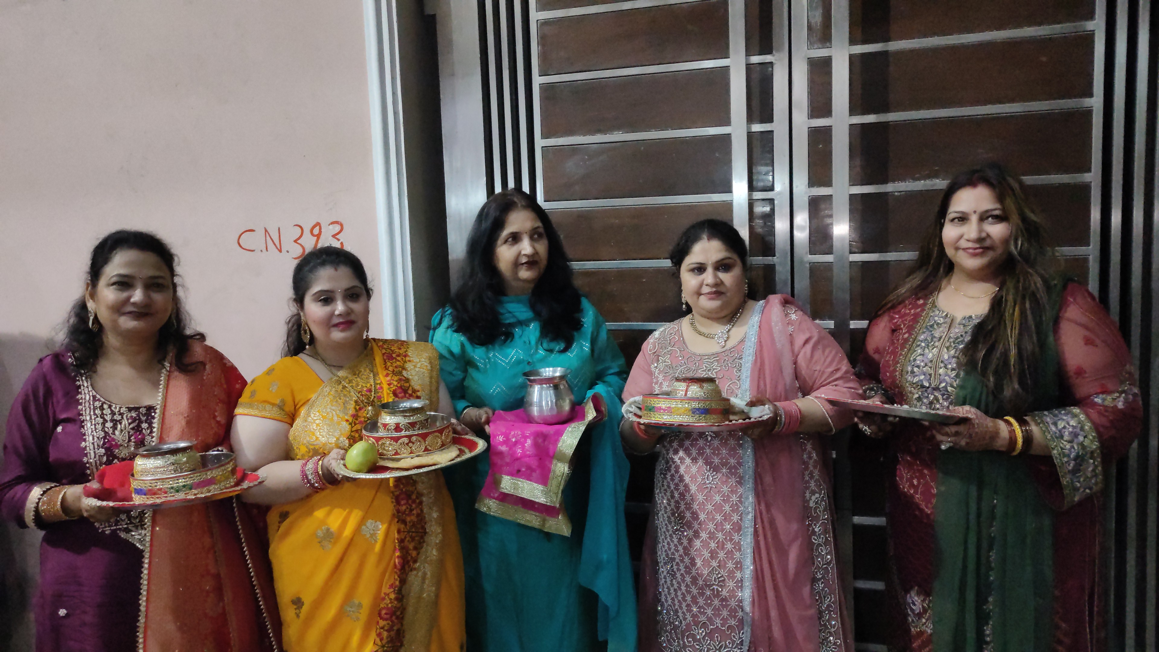 Women preparing for platter in their hands