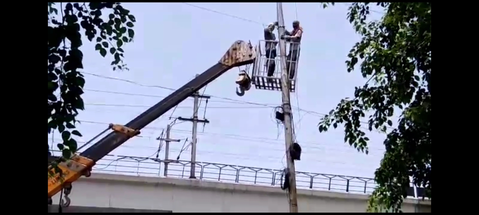 Electric poles are being painted before monsoon