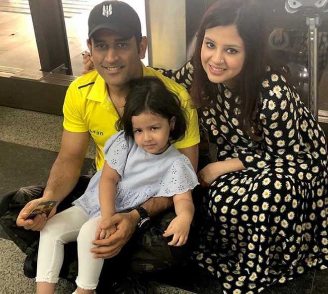 MS Dhoni with his wife and daughter Zeeva.