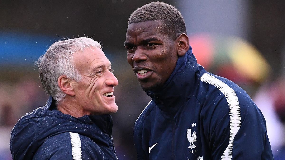 France coach Didier Deschamps with Paul Pogba.