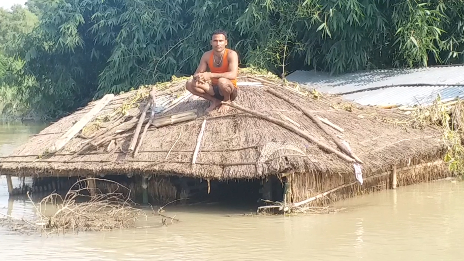 Bihar villagers forced to settle on rooftop of their huts as floods wreak havoc