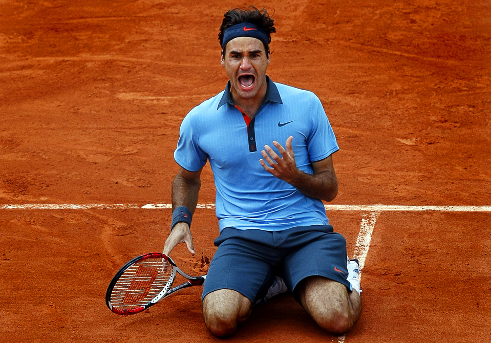 Roger Federer celebrates after completing his career Grand Slam.