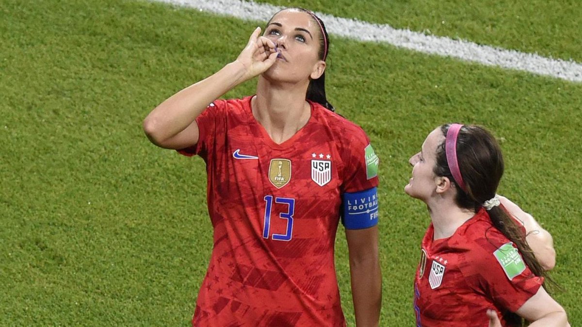 USA striker Alex Morgan celebrates after scoring goal.