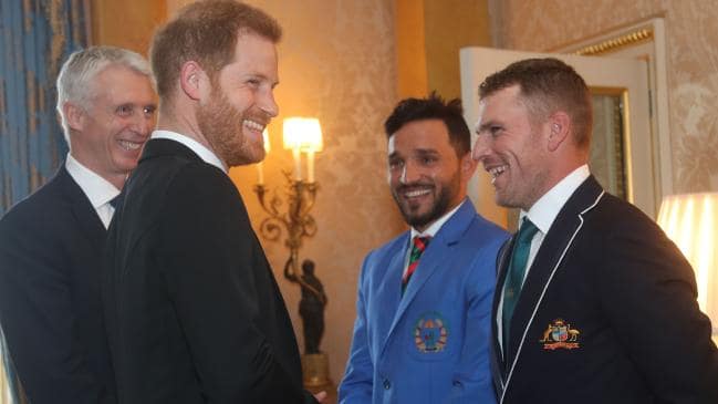 Prince Harry and Australia captain Aaron Finch share a light moment.