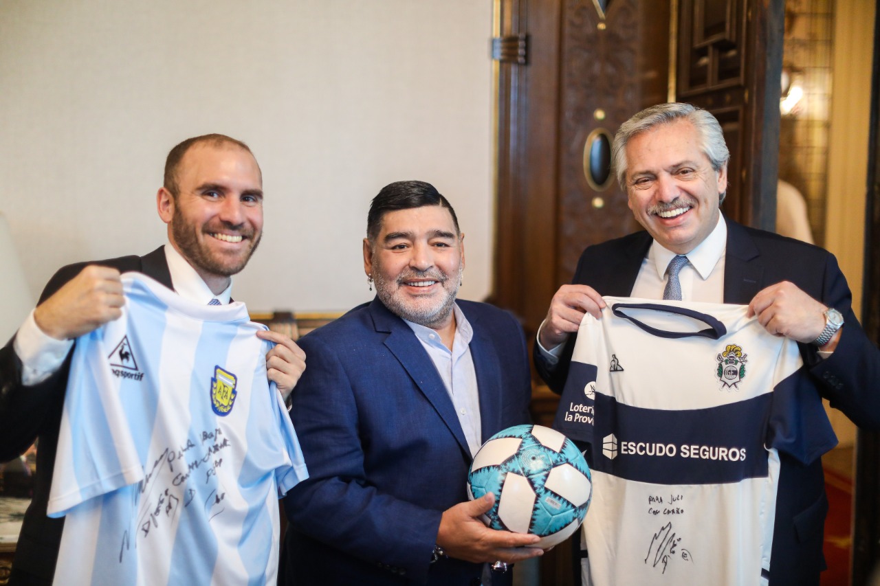 Argentinian President Alberto Fernandez (R) with Diego Maradona