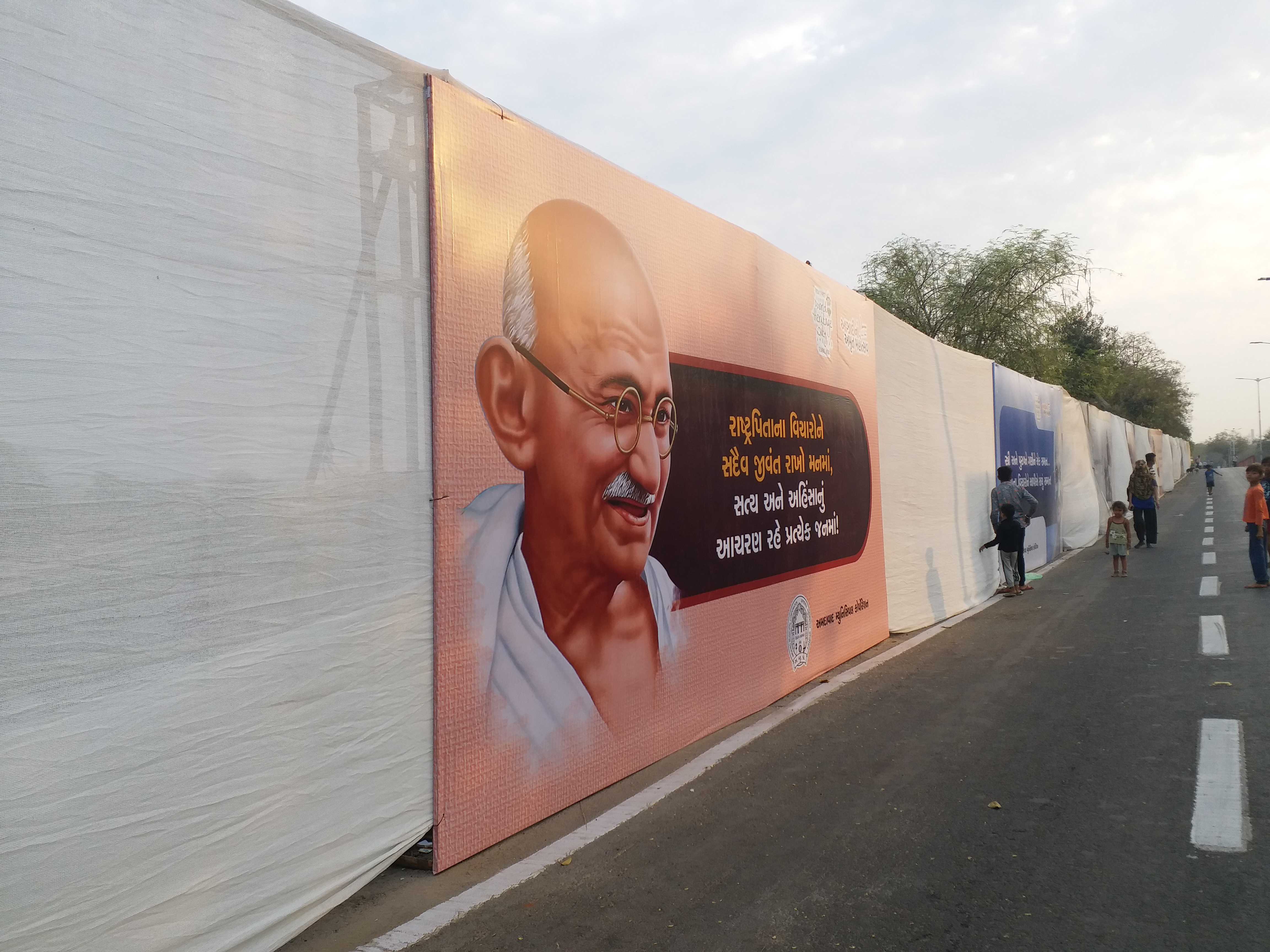 White curtains erected in Ahmedabad to cover the poor before the arrival of Prime Minister Narendra Modi