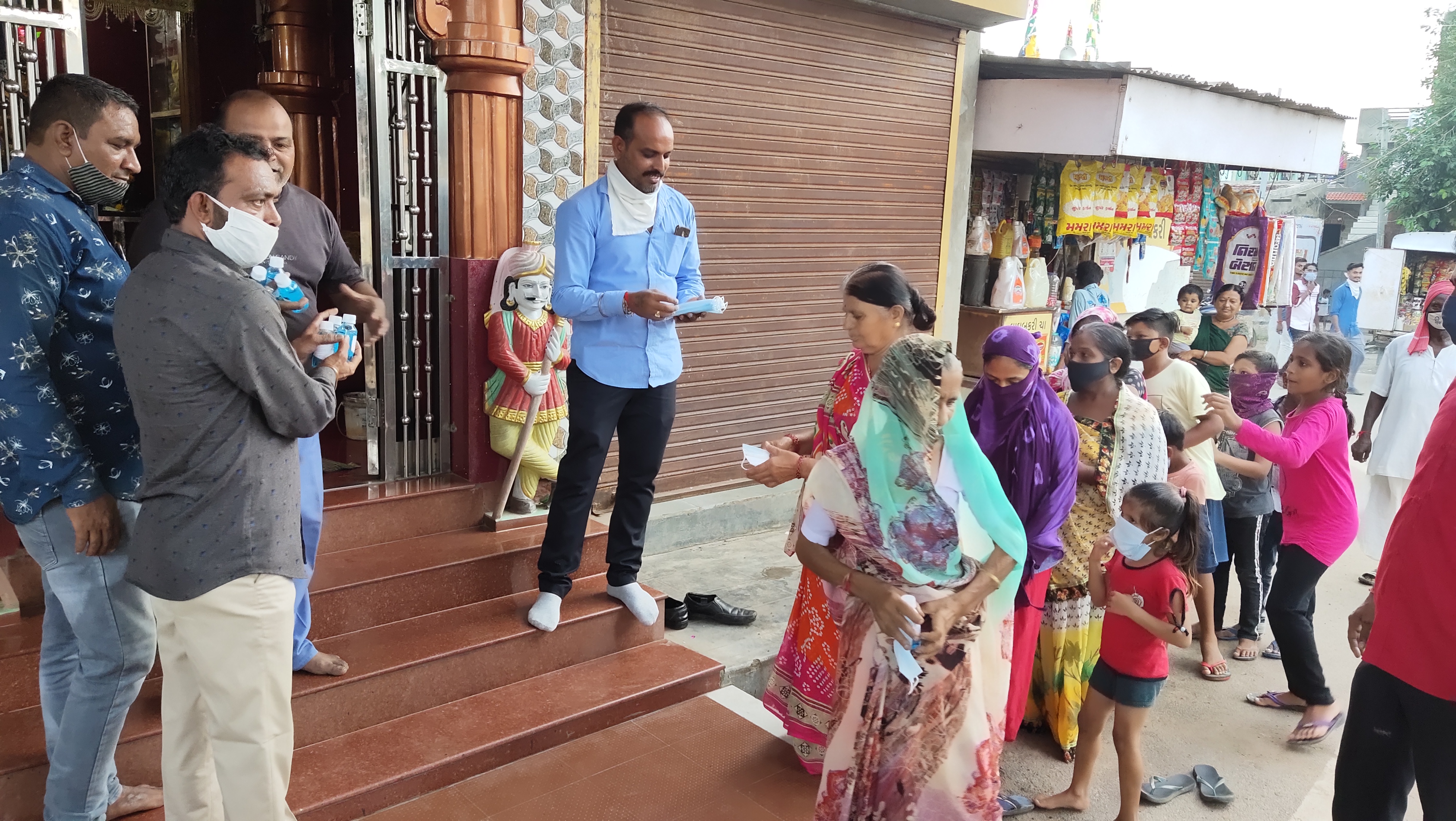 Distribution of sanitizers and masks in form of prasad at Ganpati Utsav