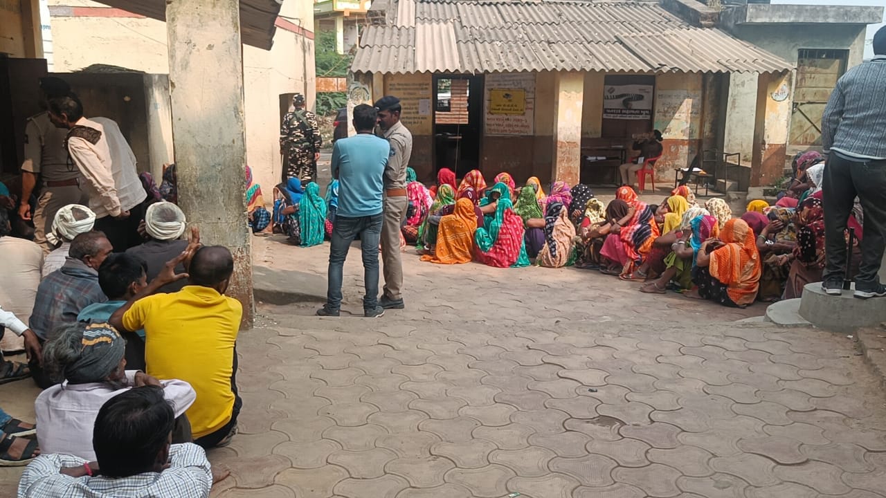 Voters sitting at the booth due to EVM malfunction