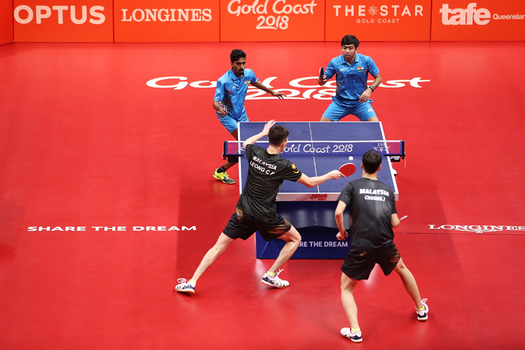 Harmeet Desai (Left) and G Sathiyan (Right) of India are in action in the 2018 Commonwealth Games men's team championship final at Gold Coast.