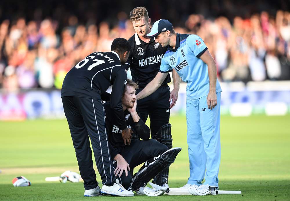 England and New Zealand console a heartbroken Martin Guptill.