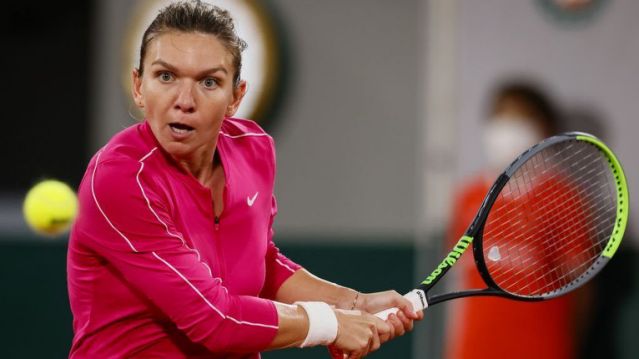 Simona Halep suffered straight-sets defeat to Iga Swiatek.