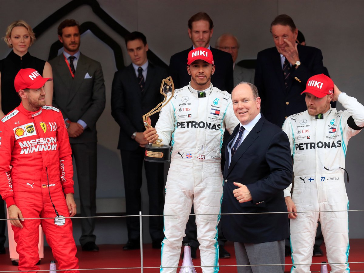 Niki Lauda holds the trophy after winning the Monaco Grand Prix.