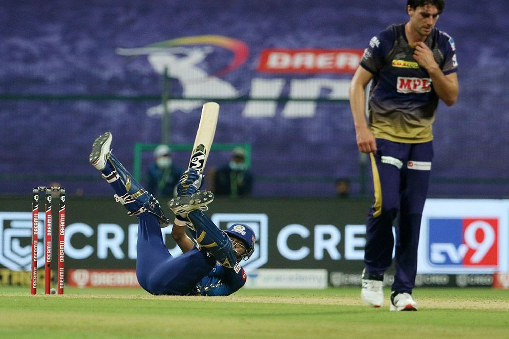 Hardik Pandya plays a scoop while rolling on the ground.