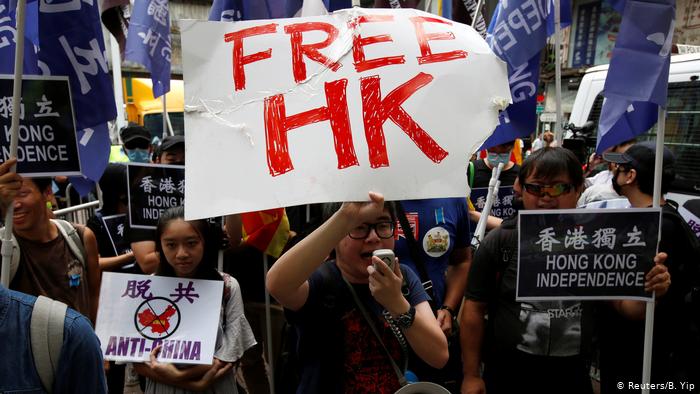 A child raises Free Hong Kong poster during the civil disobedience movement against China.