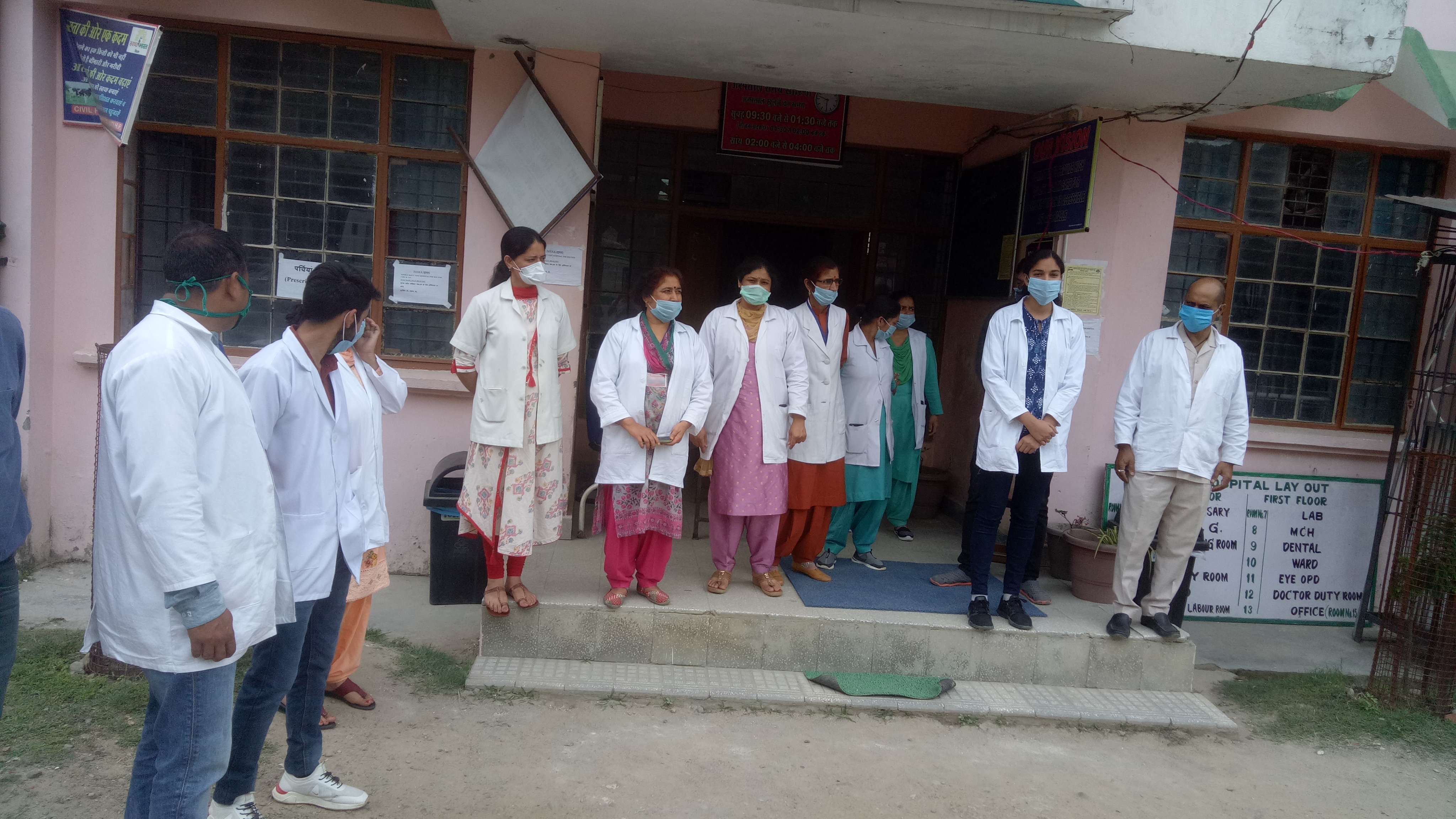 Health workers present outside Dharampur Civil Hospital