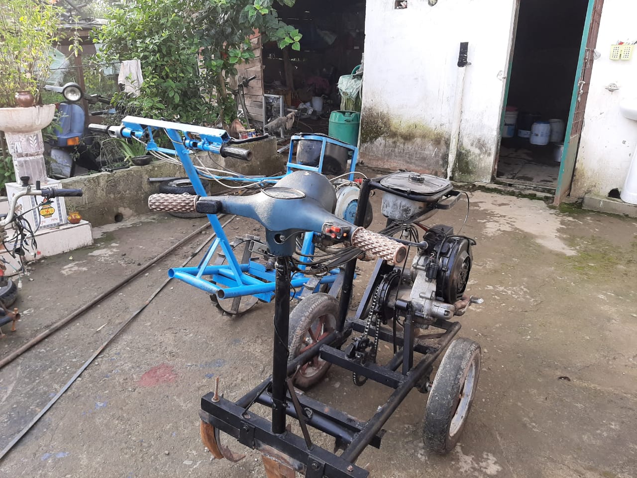 person made farm tractor with old engine in mandi