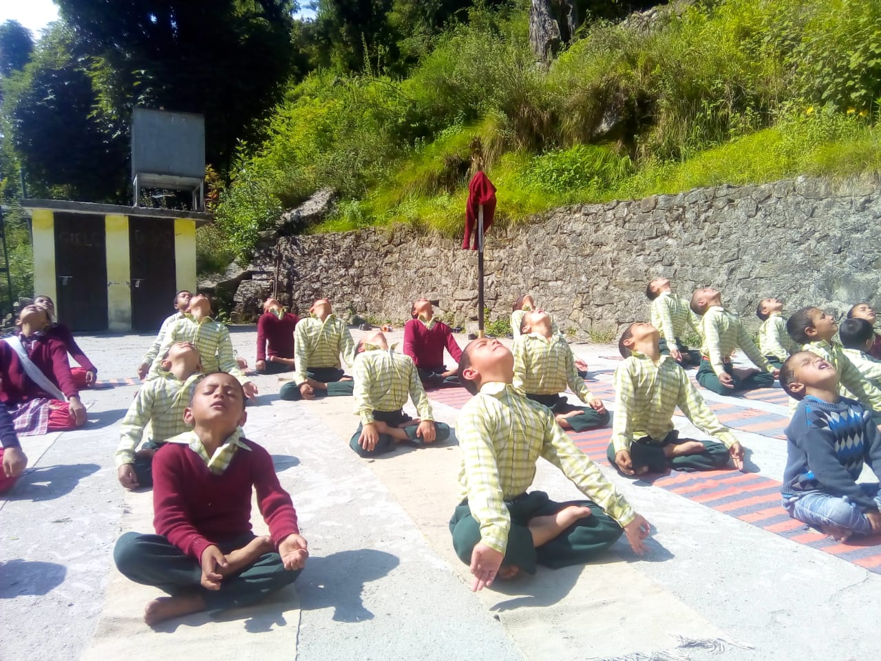 School children doing yoga