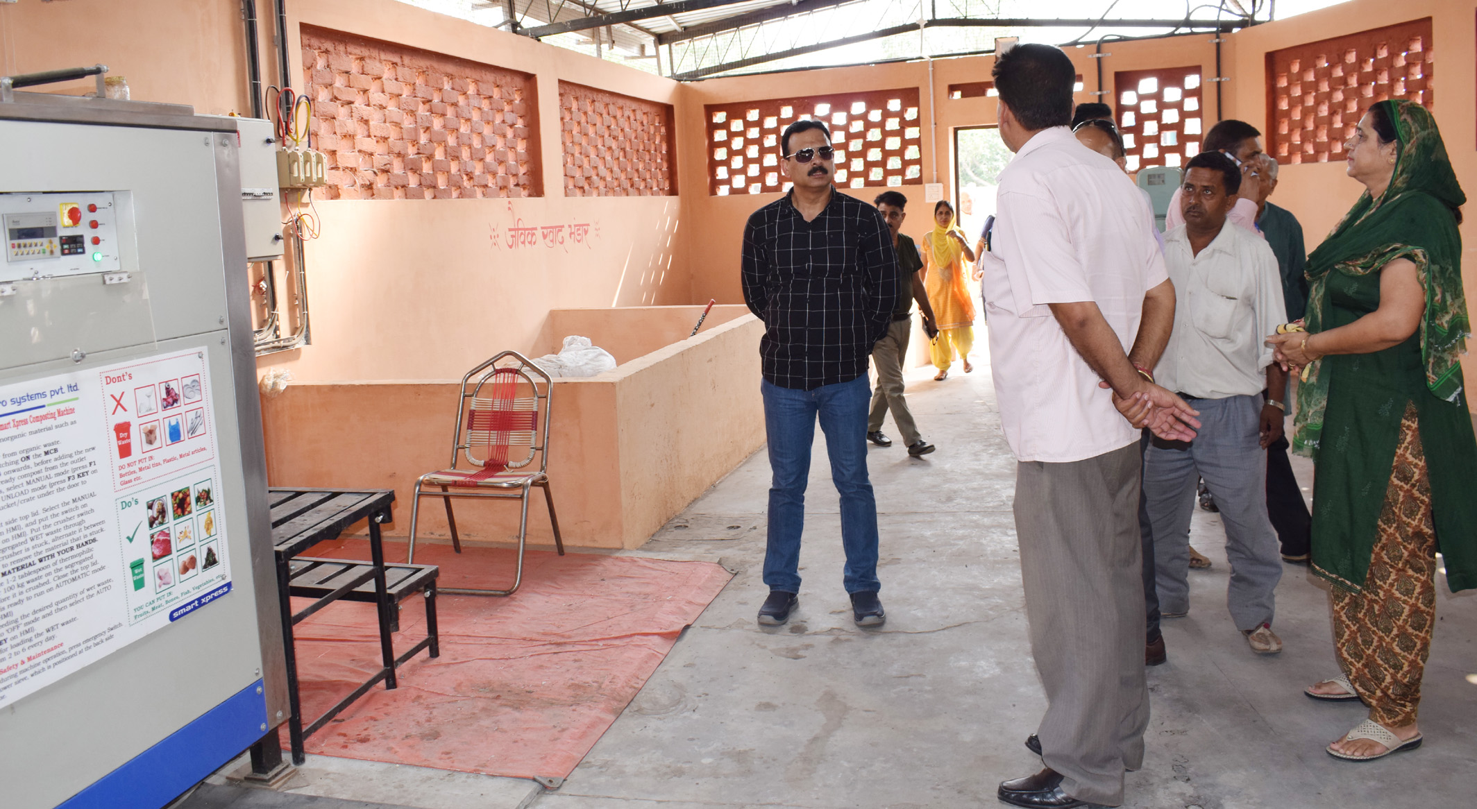 Una DC inspecting solid waste management plant