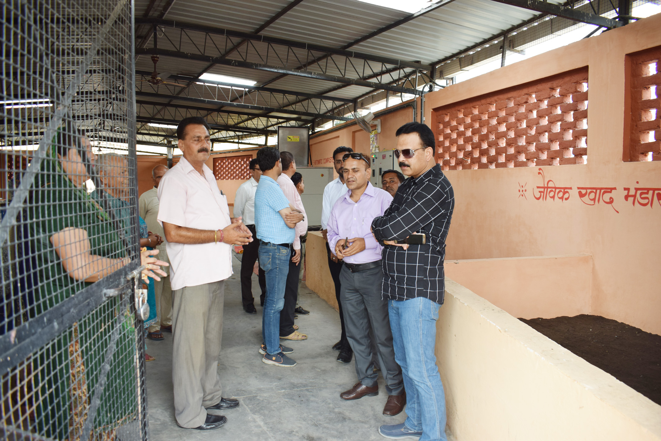 Una DC inspecting solid waste management plant