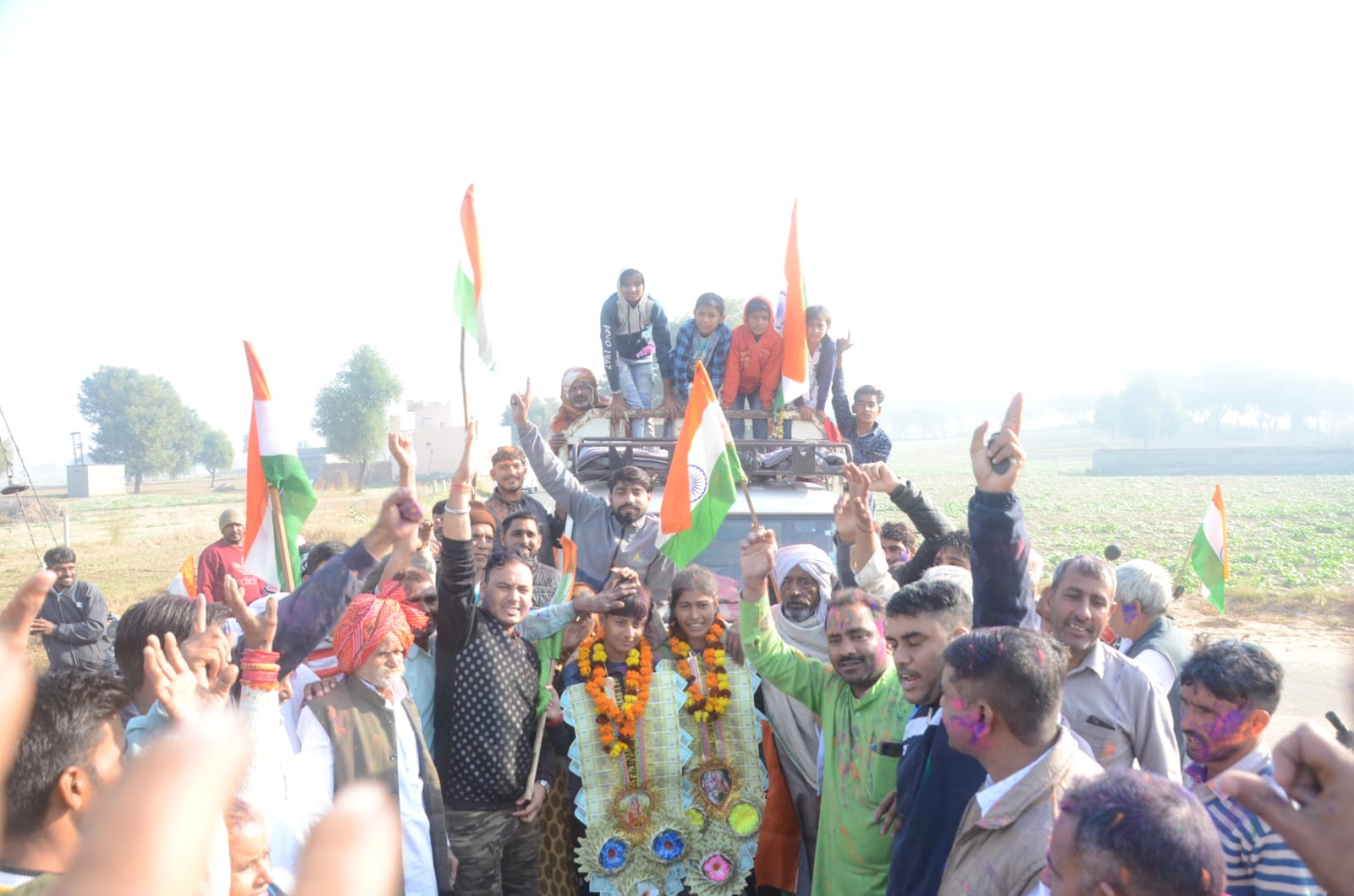 Haryana girls are welcomed grandly on reaching village Bajina in Bhiwani