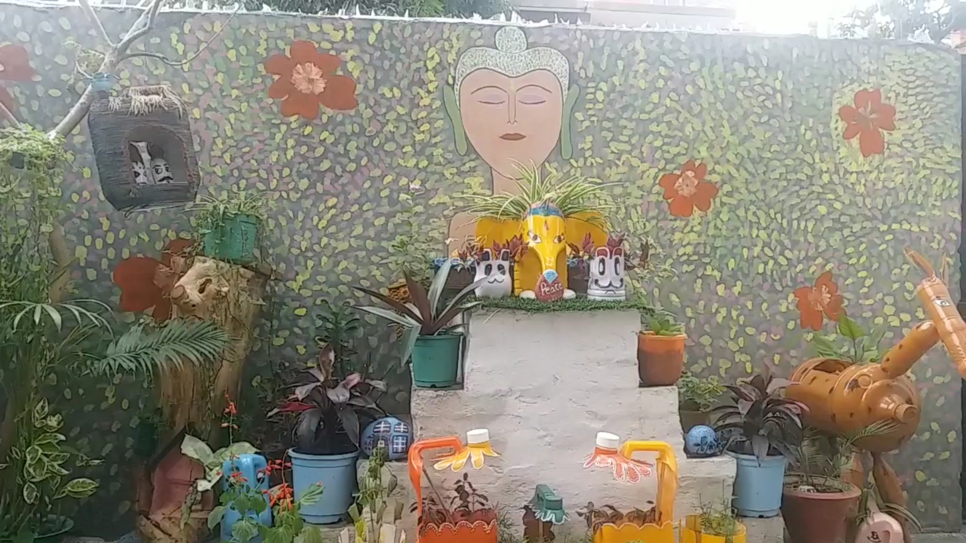 beautiful flower pot by useless boxes and bottles