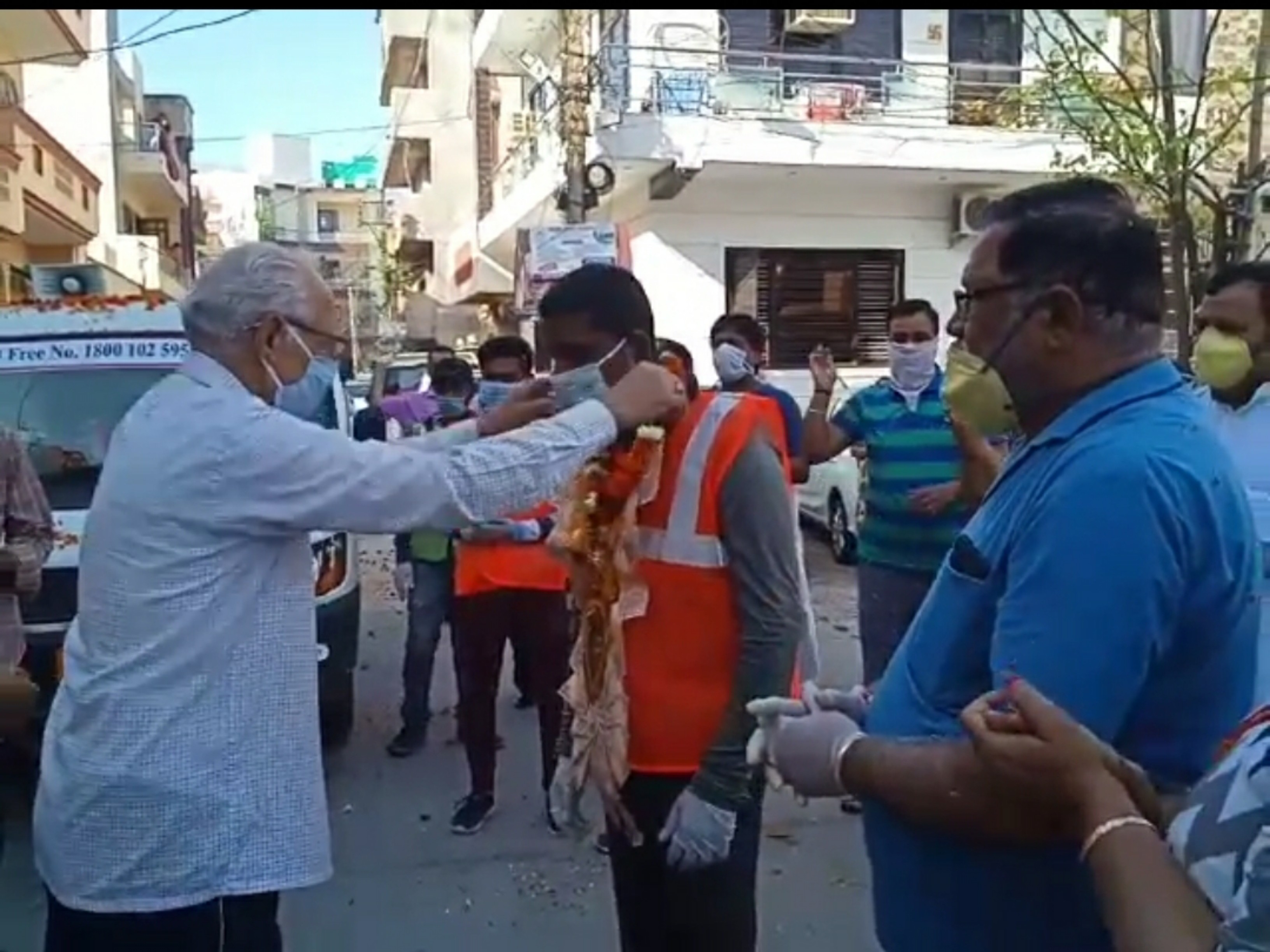 People shower flowers on sanitation workers in Gurugram amid coronavirus outbreak