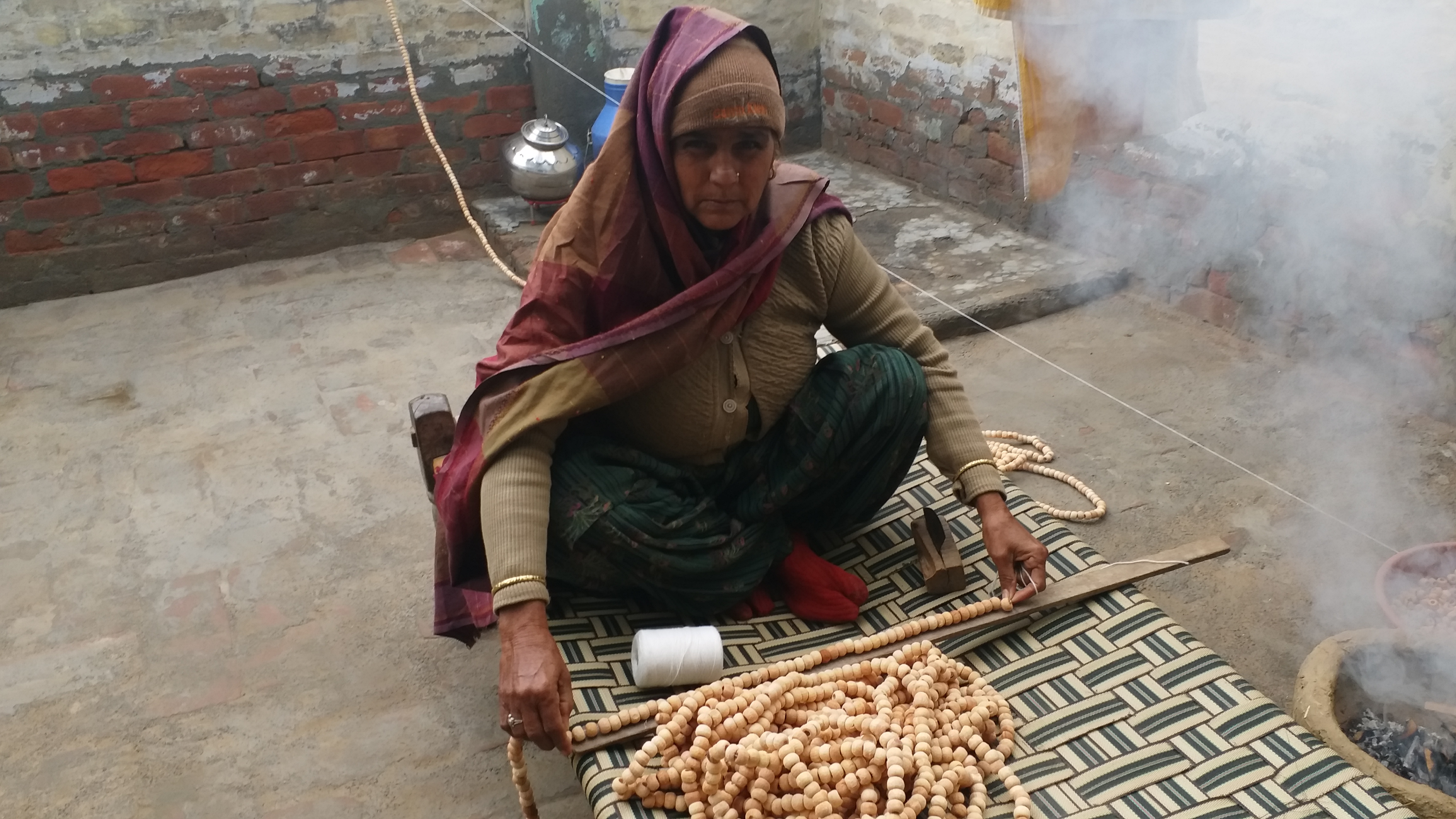 making garlands of beads Hisar