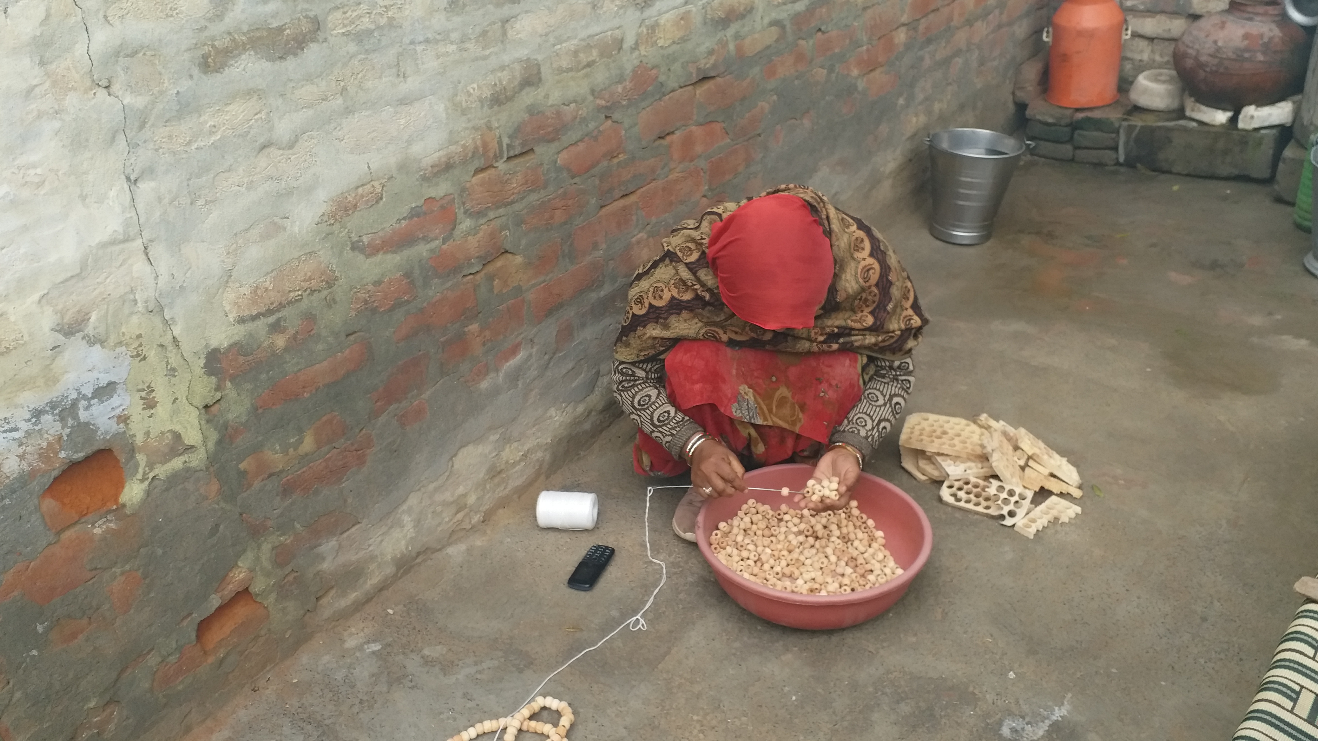 making garlands of beads Hisar