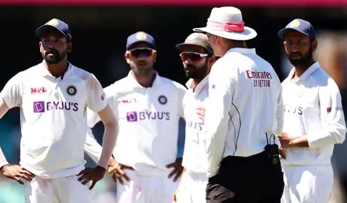 Indian cricketers and umpire Paul Reiffel during day four of the third Test at the SCG.