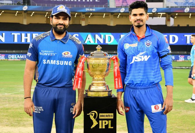 Mumbai Indians skipper Rohit Sharma and Delhi Capitals captain Shreyas Iyer with the 2020 IPL trophy.