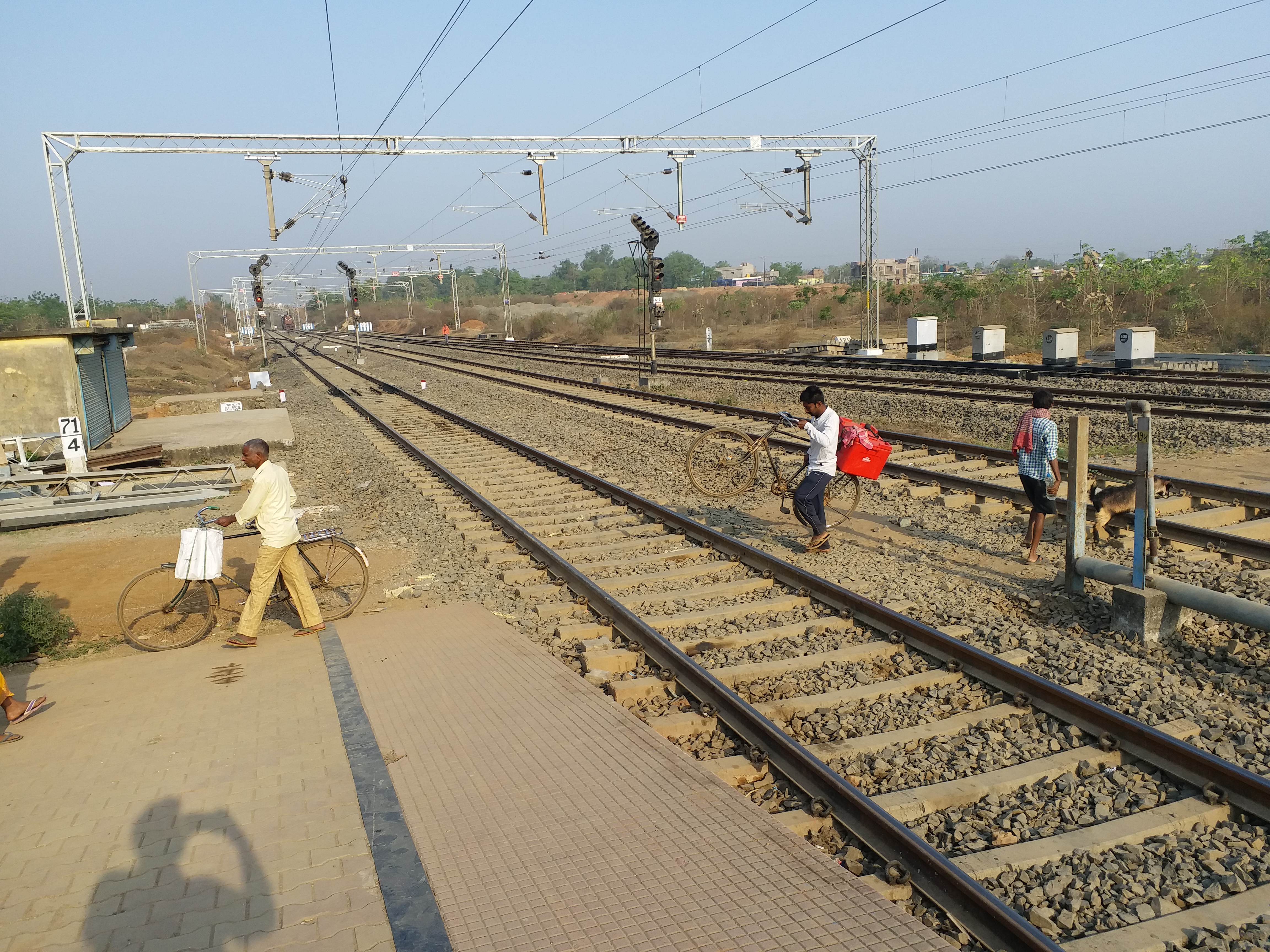 People crossing tracks at Dumka station