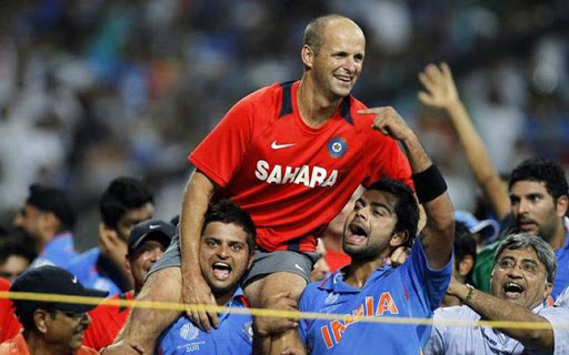 Gary Kirsten on the shoulders of Suresh Raina and Virat Kohli as India win the 2011 World Cup.