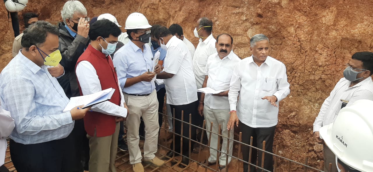 V Somanna reviewing Rajiv Gandhi Housing Scheme building