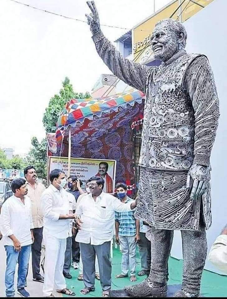 Statue of Prime Minister Modi by automobile scrap