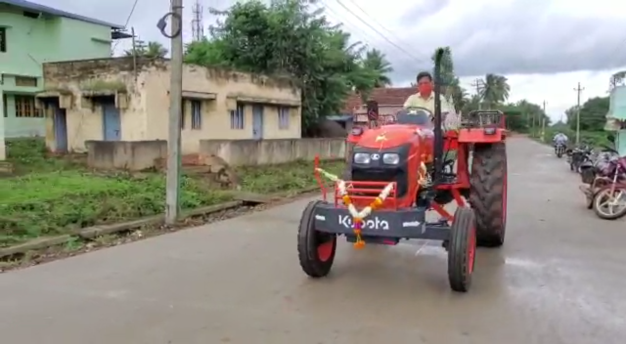 M. P. Renukaacharya driven  tractor