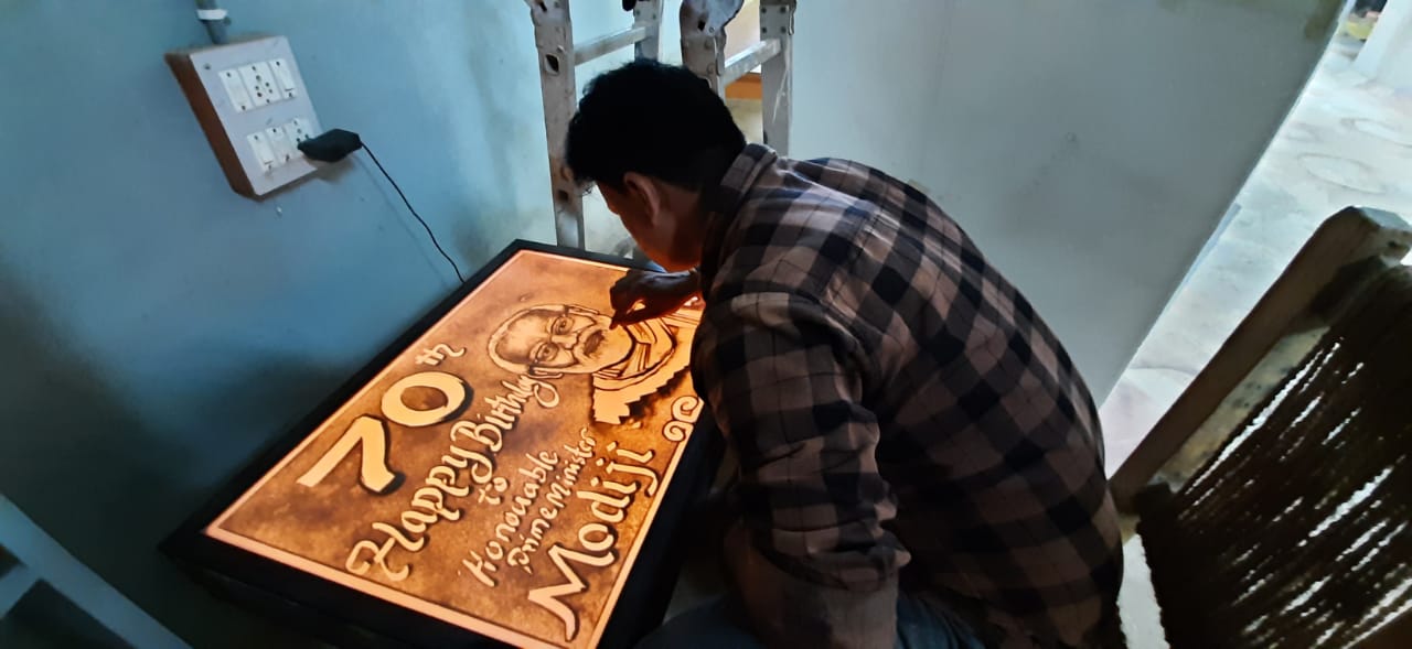 Dharwad artist wishes PM Modi through his sand art