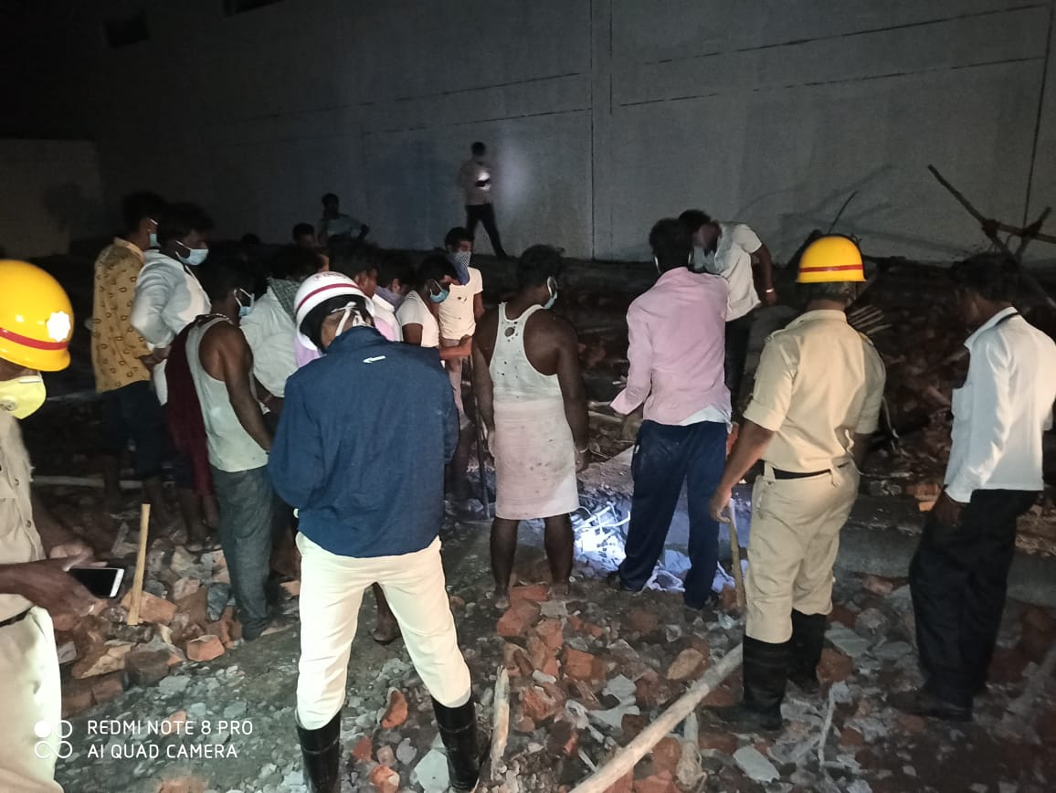 A construction stadium wall collapses and a worker dies