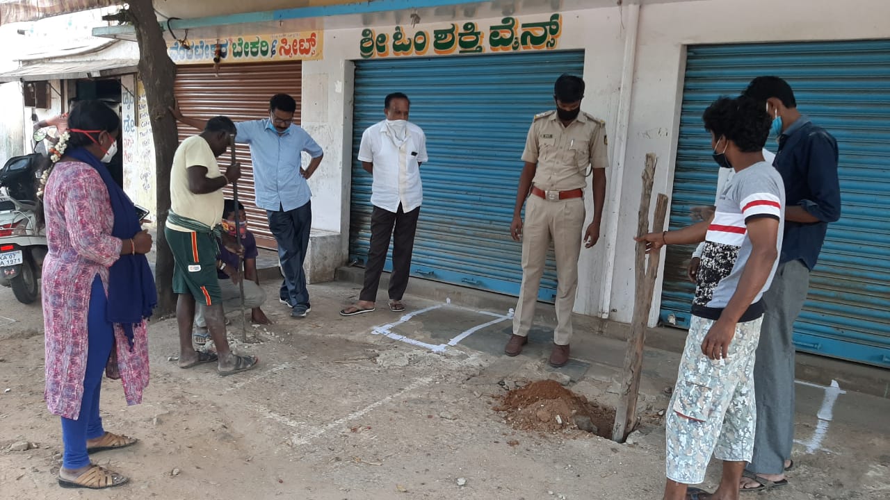 People line up at a liquor shop in Bengaluru as state government permits the sale of liquor