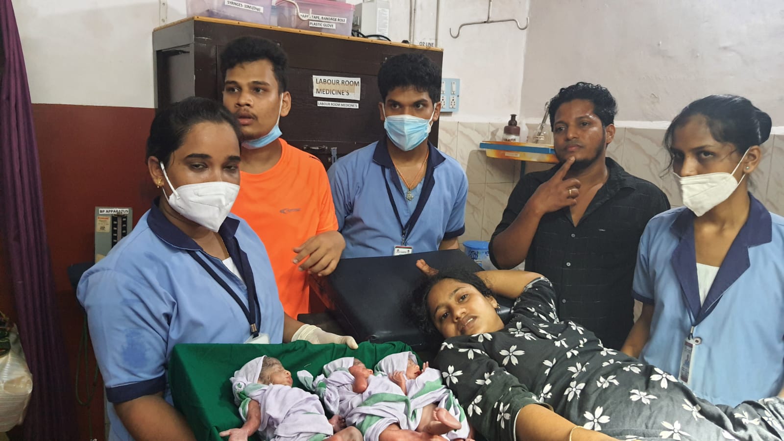 woman gives birth to three children