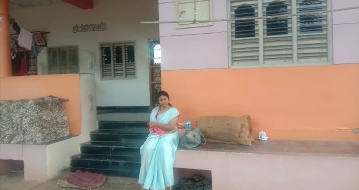 Young woman protest for justice in front of a young man house