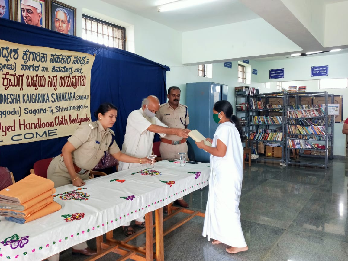 Charaka Agency distributes free saris as a form of protest