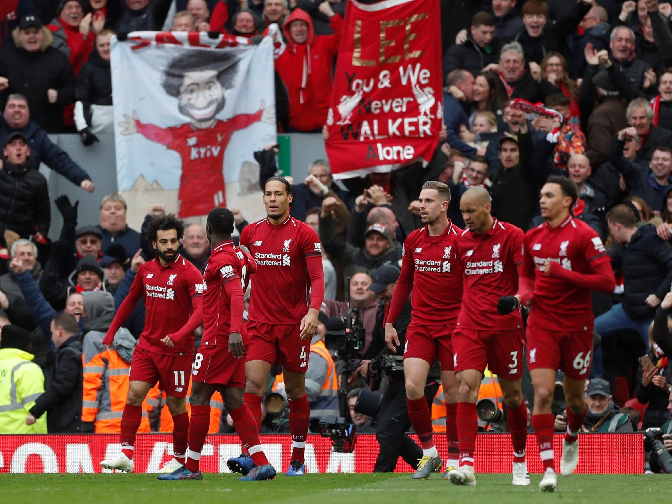 Liverpool players acknowledge support of Anfield fans.