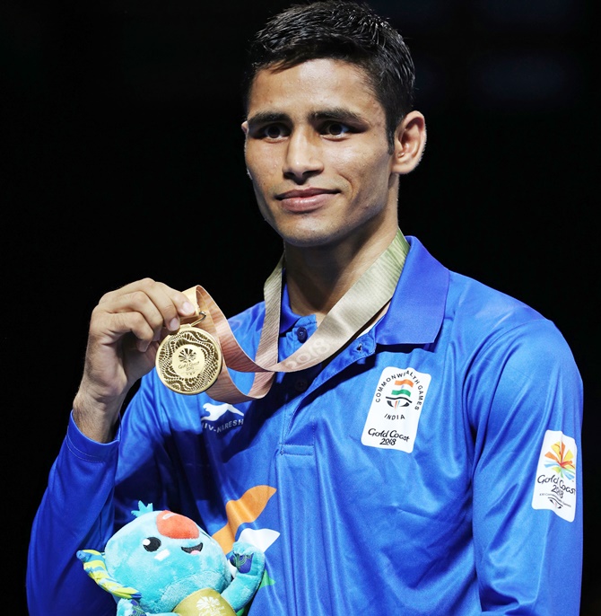 Manish Kaushik poses with the bronze medal.