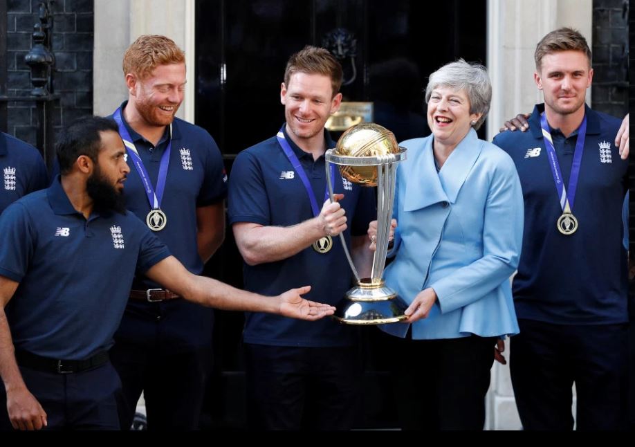 Britain PM Theresa May celebrates WC victory with the players.